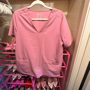 Pink women’s figs scrub top.